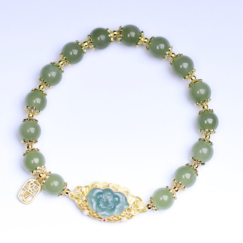 Hetian Jade Lotus Bracelet - top-down view on white background revealing full beaded design, lotus charm bracelet