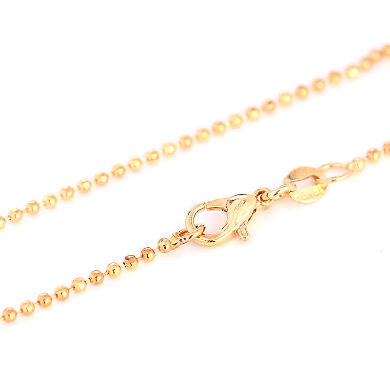 Quartz Crystal Tree of Life Necklace – gold ball chain with spring ring clasp close-up, jewelry hardware