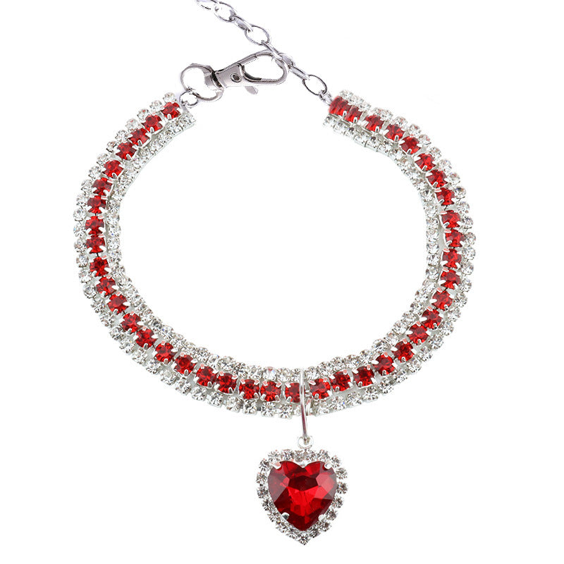 Heart Crystal Pet Collar – triple row red crystal band with heart pendant, lobster clasp, white flat lay