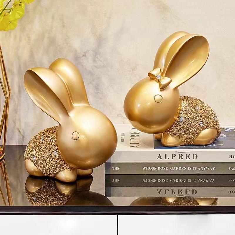 Lucky Rabbit Statue – golden crystal rabbits on stacked books with marble background, luxury home decor