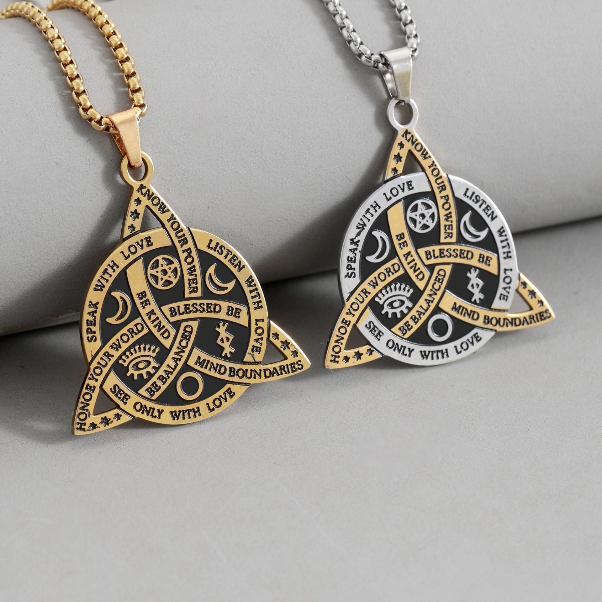Celtic Moon Star Necklace – gold and silver triquetra pendants on gray background, pagan jewelry pair