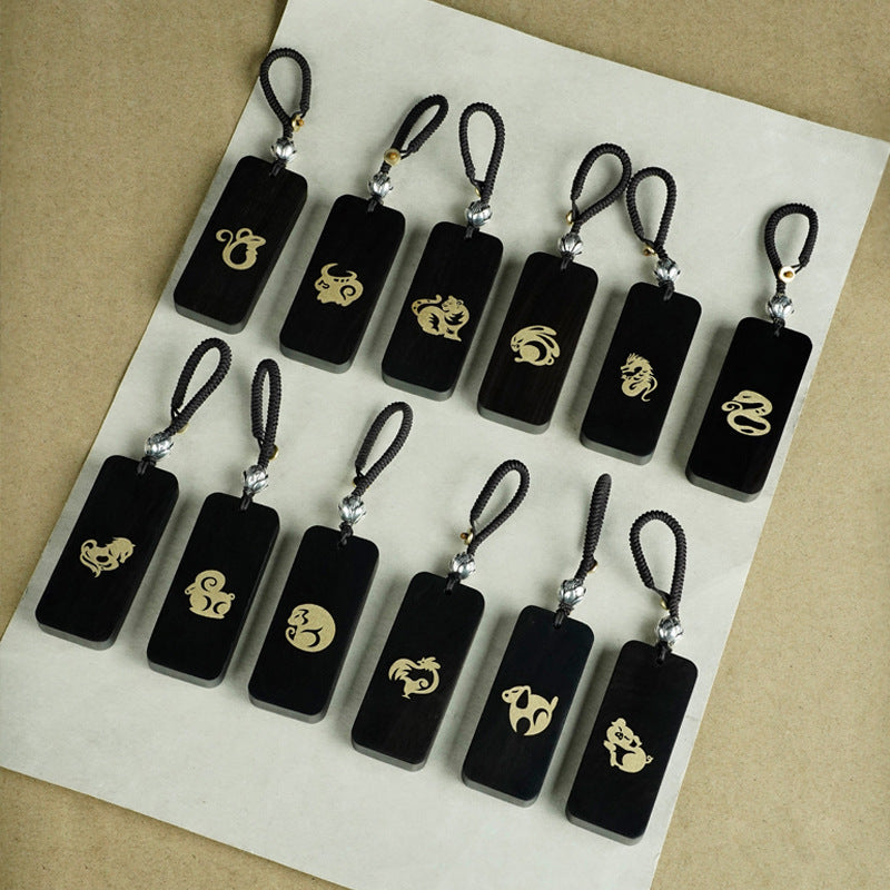 Ebony Big Dipper zodiac keychain with silver inlay Ox symbol and celestial script