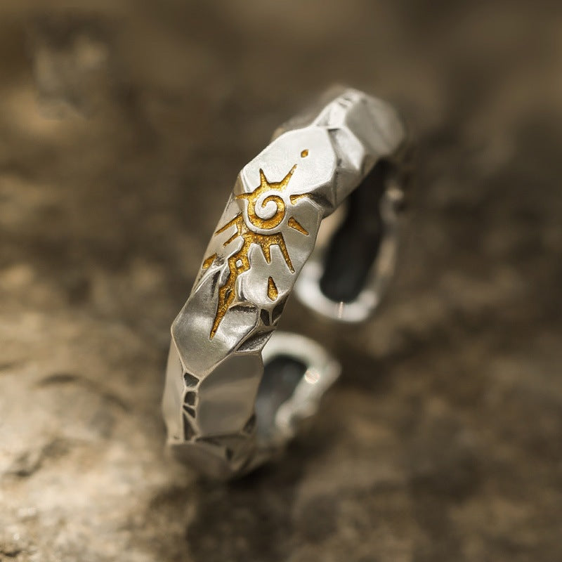 Self-Discipline Ring – Close-up of faceted silver band with engraved gold sun symbol, mindfulness ring