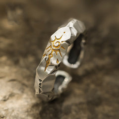 Self-Discipline Ring – Close-up of faceted silver band with engraved gold sun symbol, mindfulness ring
