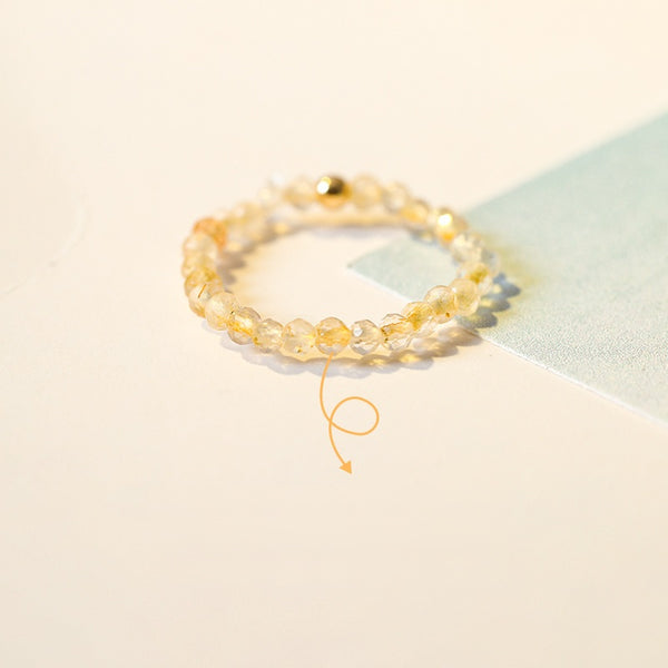 2mm Citrine Ring – Citrine beads with gold bead on cream and light blue card, wealth crystal ring