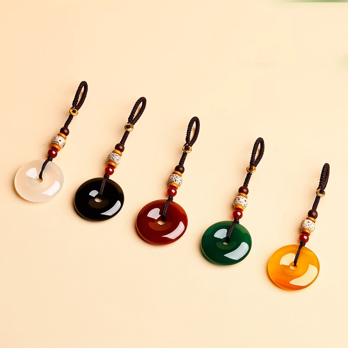Jade Keychain Pendant – Five color jade donuts in row white black red green yellow on beige, feng shui keychain set