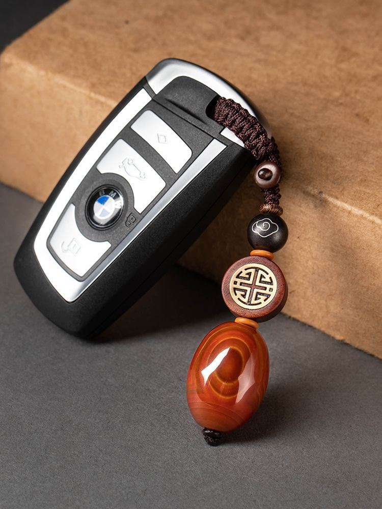 Red Agate Car Keychain – wan-symbol design on BMW car key with gray background, lucky car key accessory