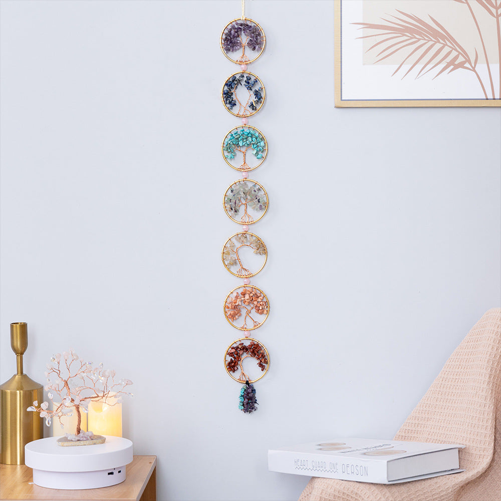 Chakra Tree of Life – seven crystal tree wall hanging in living room with plants, energy healing decor