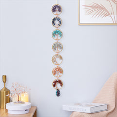 Chakra Tree of Life – seven crystal tree wall hanging in living room with plants, energy healing decor