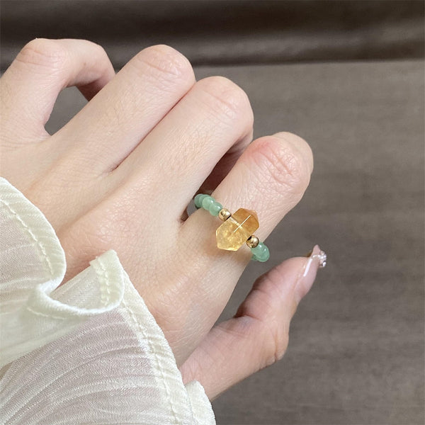 Citrine Aventurine Ring – Citrine crystal and green aventurine ring worn on finger with white sleeve, wealth ring
