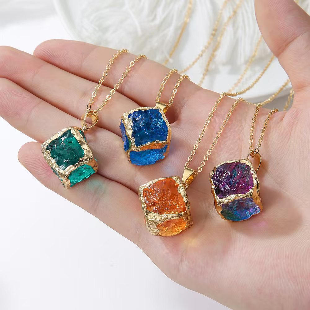 Gemstone Chip Pendant – Four gemstone cube pendants held in palm showing gold rim detail, natural stone necklace