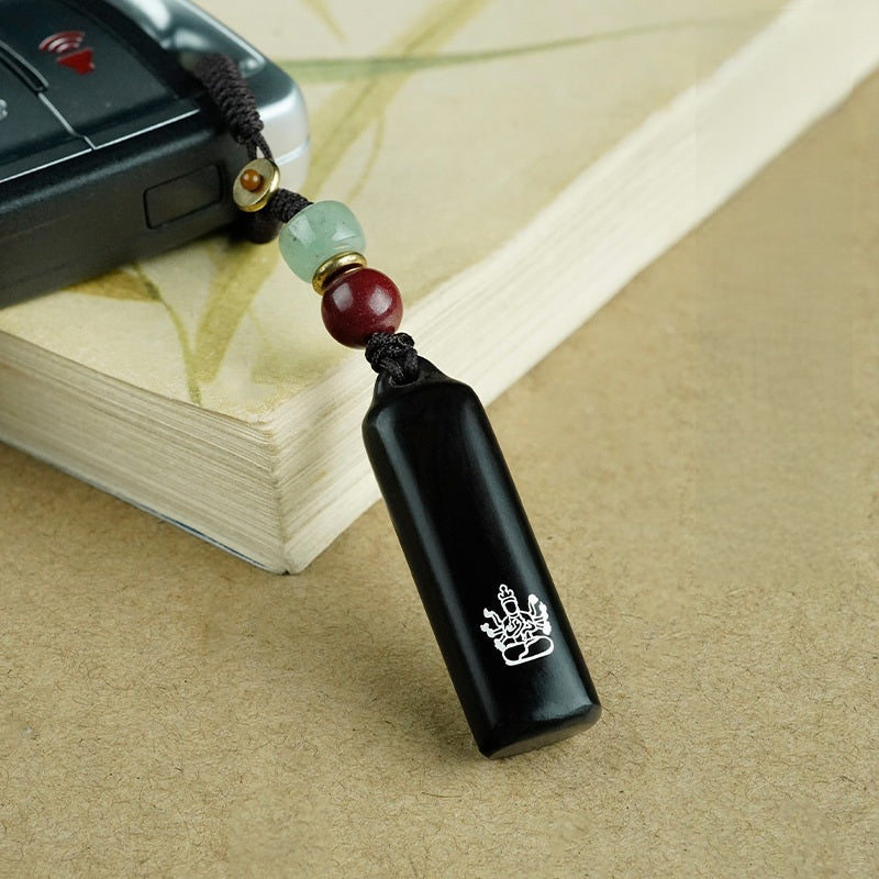 Ebony Eight Guardians talisman keychain with silver inlay for Ox and Tiger zodiac Buddhist protection