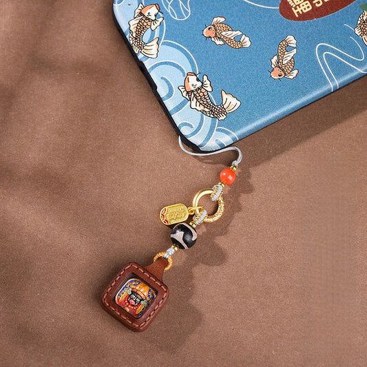 Tibetan Zakiram Thangka Amulet Keychain, front view, lucky charm