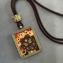 Tibetan Thangka Pendant – gold bezel wrathful black face deity with jeweled crown, brown necklace, spiritual talisman