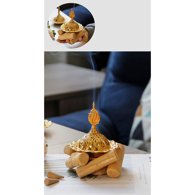 Gold Alloy Mini Incense Burner – composite with inset hands holding burner and incense cones on wood, gold mini incense burner