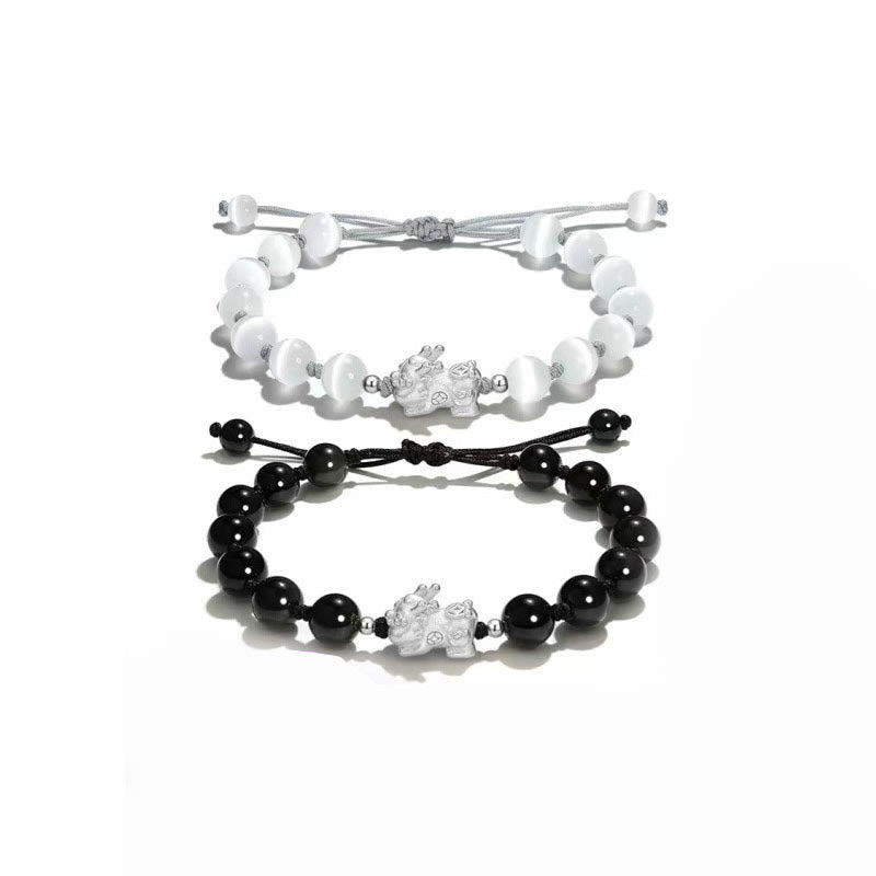 Black Obsidian PiXiu Bracelet – Black and white PiXiu bracelets pair on white background