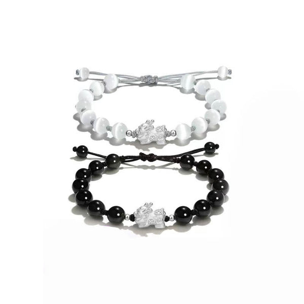 Black Obsidian PiXiu Bracelet – Black and white PiXiu bracelets pair on white background