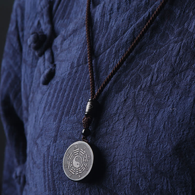Black Obsidian Bagua Yin Yang Pendant - Obsidian bagua necklace worn with traditional jacket, black pendant