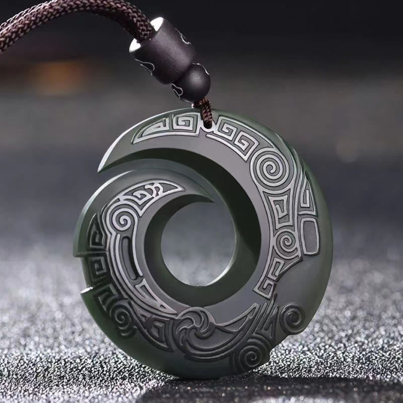 Hetian Cyan Jade Peace Buckle Luck Necklace – Dark green carved jade pendant with spiral cutout design, traditional cloud motifs, and black braided cord on dark background