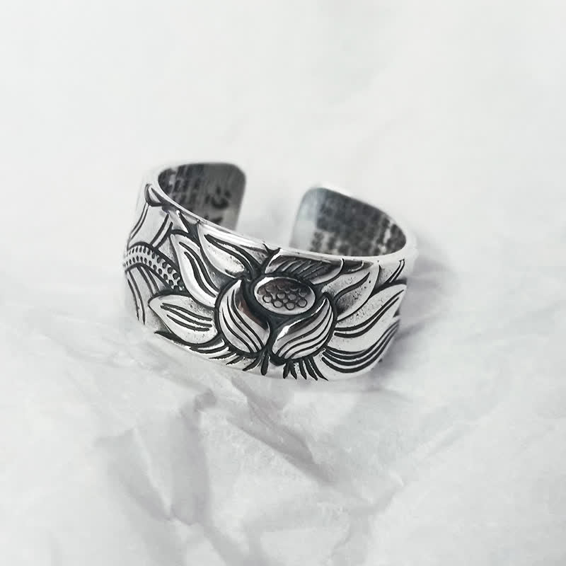 999 Silver Lotus Ring – oxidized lotus relief on white fabric, adjustable open cuff