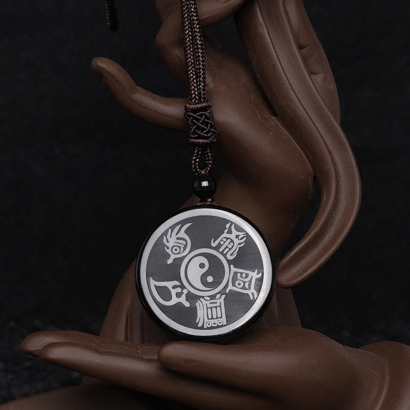 Black Obsidian Nine-Character Mantra Necklace – Yin-Yang Bagua obsidian pendant on ceramic hand, Eastern spiritual jewelry