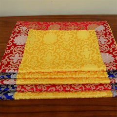Dragon Vajra Altar Table Runner – Layered yellow red blue cloths on brown table, ornate