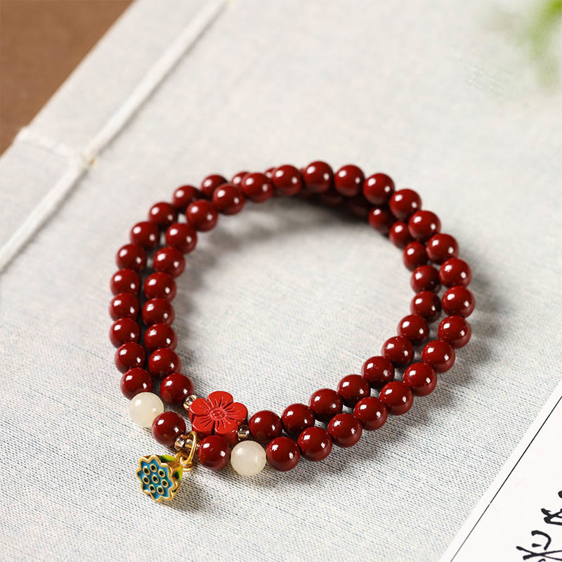 Cinnabar Lotus Bracelet – red beads with lotus charm on linen, cinnabar wrap bracelet