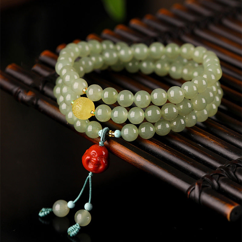 Jade Red Agate Laughing Buddha Bracelet - Front view with carved amber Buddha charm, prosperity jewelry