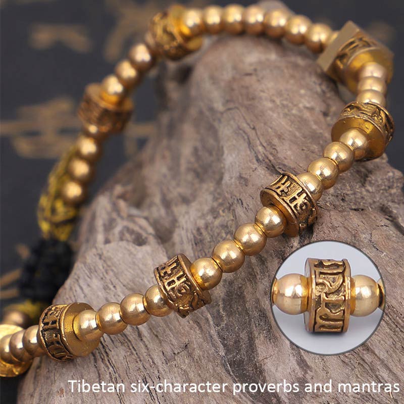 Tibetan Gold Om Mani Padme Hum Bracelet – On driftwood with mantra bead close-up inset, Tibetan bracelet