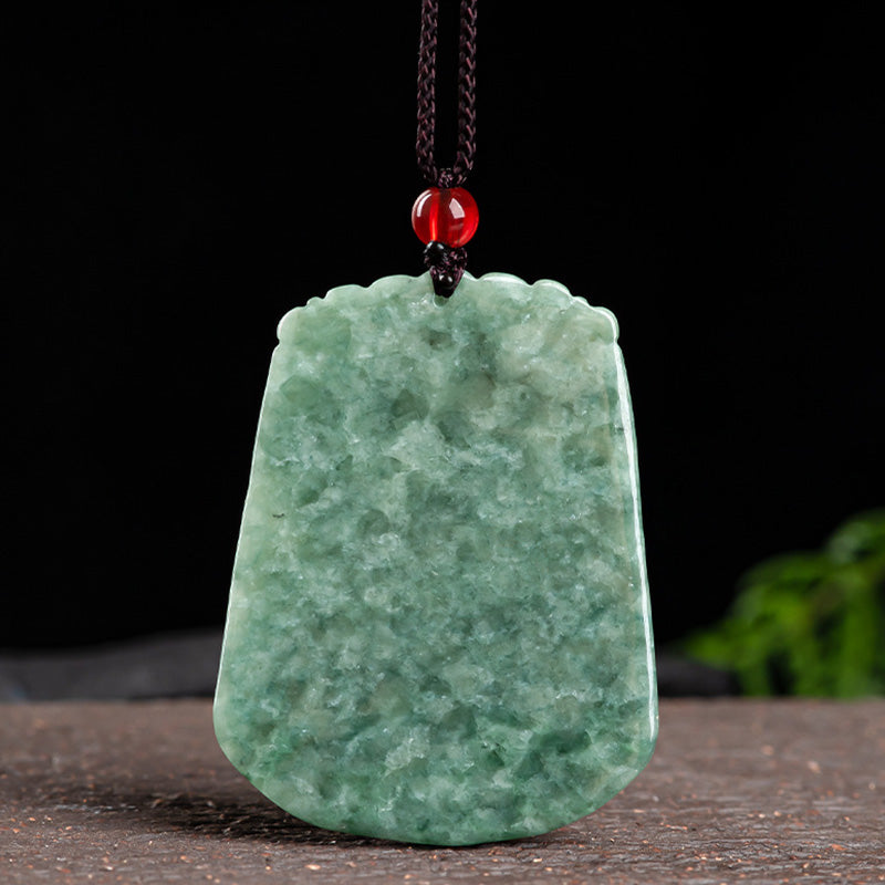 Chinese Zodiac Dragon Jade Strength Necklace - cloud-border jade pendant on black background with foliage, strength