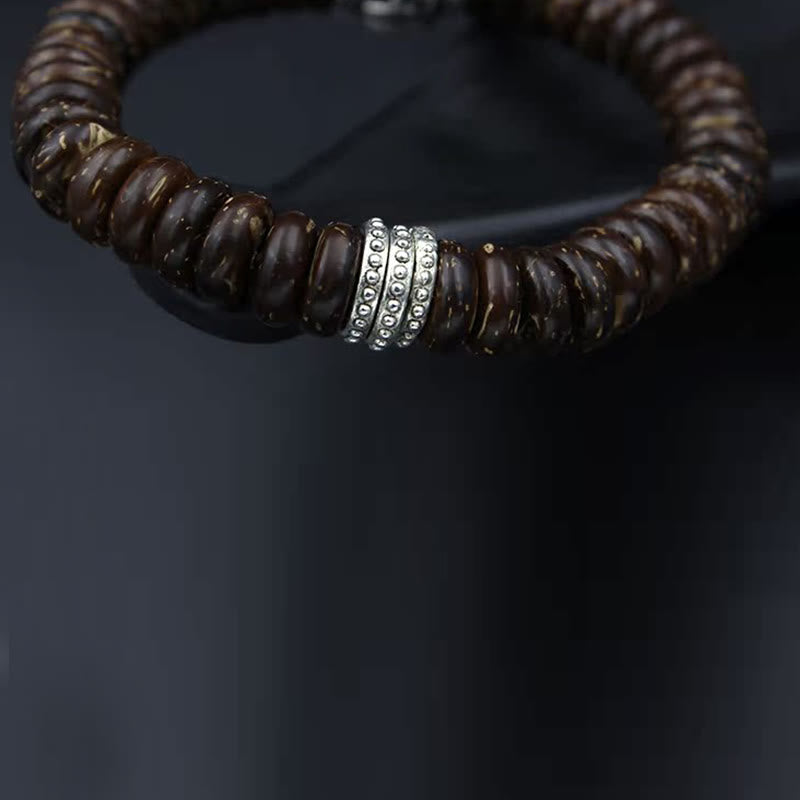 Om Mani Padme Hum Coconut Shell Bracelet – three-quarter view, dotted silver center bead