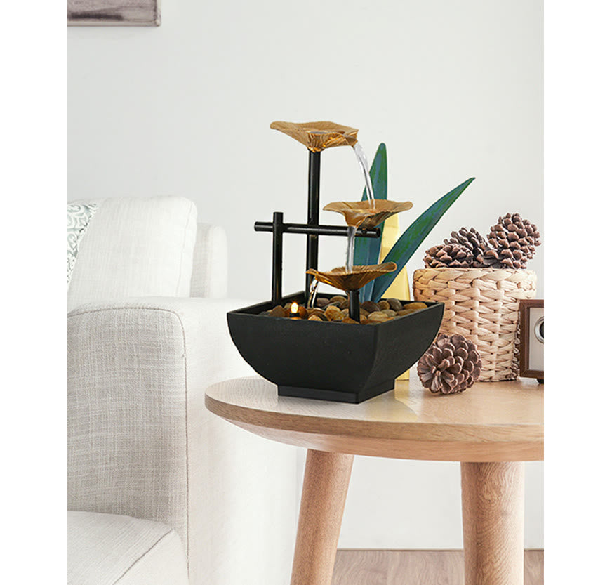 Three Layers Lotus Waterfall Fountain - Gold tiers on round side table with sofa, Inviting