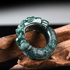 Natural Cyan Jade Dragon Ring elevated angle, flowing mane detail, weathered wood, carved success ring