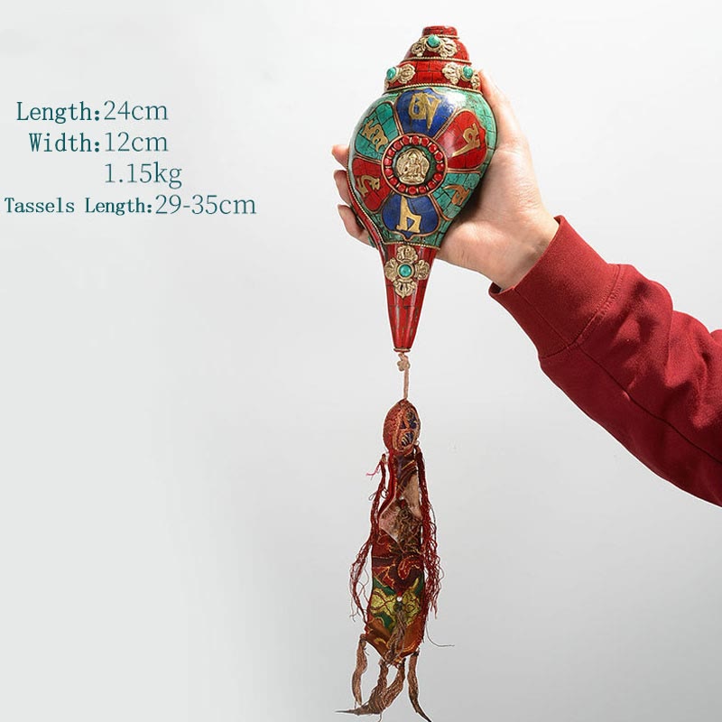 Turquoise Shankha Conch – wrapped in saffron monk cloth with prayer flag background, authentic Himalayan