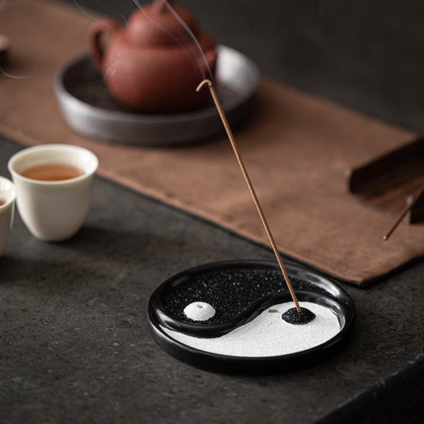 Yin Yang Incense Holder – Lit incense with smoke curls beside teapot and tea cups, Balanced
