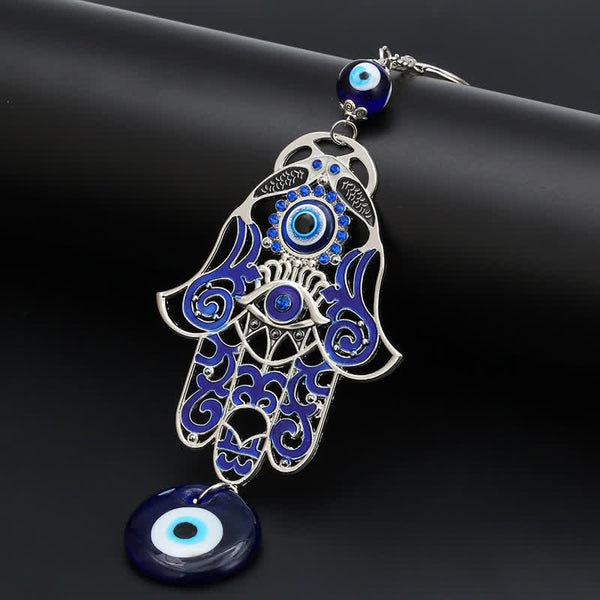 Hamsa Symbol Home Decoration – Silver Hamsa amulet with blue enamel filigree on black, evil eye keychain