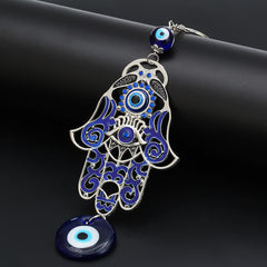 Hamsa Symbol Home Decoration – Silver Hamsa amulet with blue enamel filigree on black, evil eye keychain