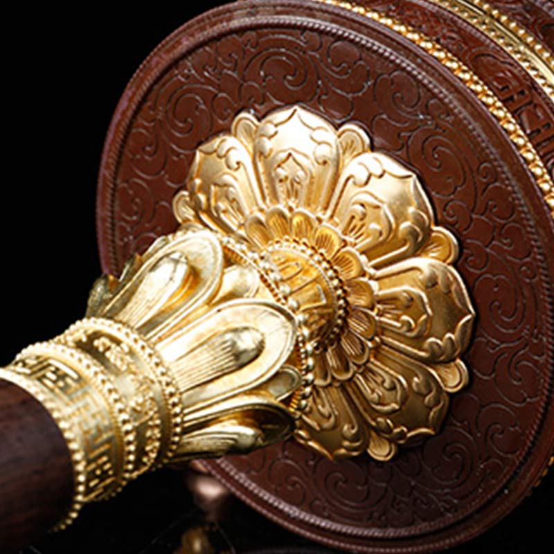 Copper Prayer Wheel – Macro of lotus petal gold fitting at handle junction, mindfulness tool