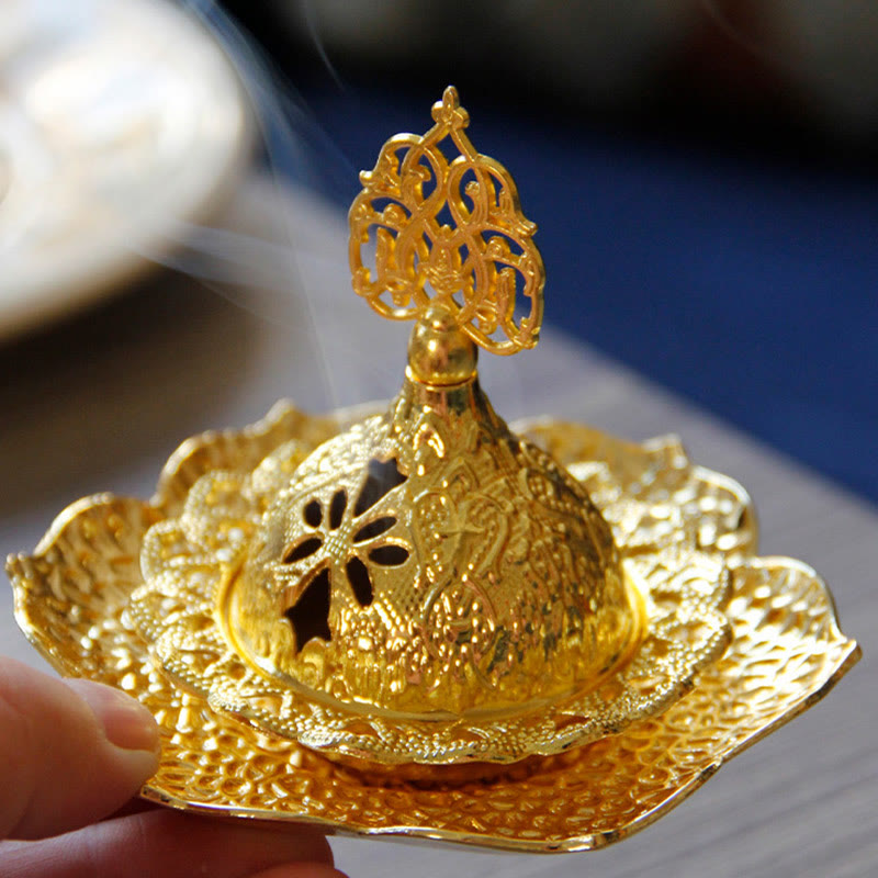 Gold Leaf Coaster Incense Burner with active smoke on wooden table, pierced dome design, alloy incense burner