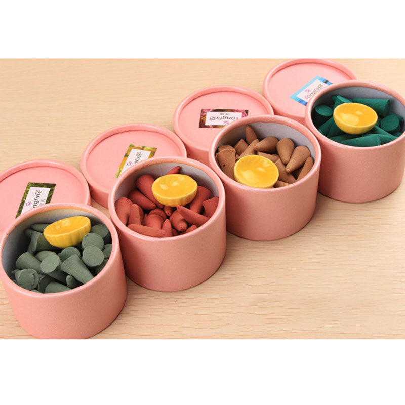 Tibetan incense cones – five open pink gift boxes with green and coral scented cones, aromatherapy