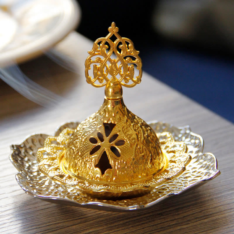 Gold Leaf Coaster Incense Burner with smoke on wood grain, pierced lotus dome, alloy incense burner