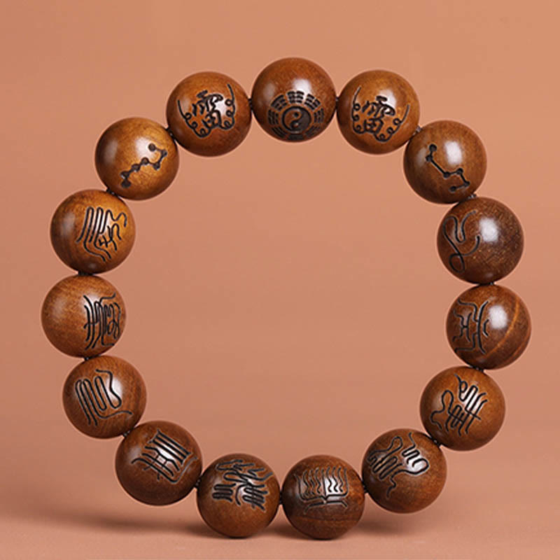 Lightning Struck Jujube Wood Taoist Scripture Bracelet - Wood prayer bracelet with seal script symbols on peach backdrop, carved wood jewelry