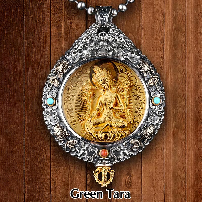 Zodiac Buddha Thangka Wealth Rotatable Pendant – Green Tara front view on wooden backdrop with ornate silver frame, mercy