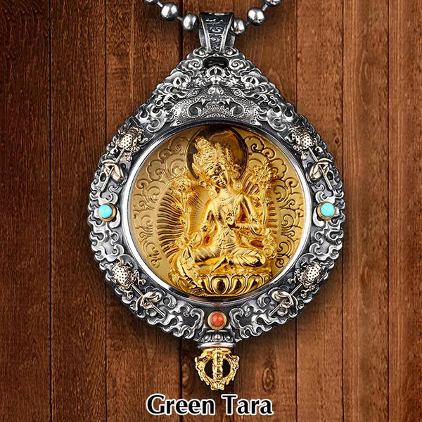 Zodiac Buddha Thangka Wealth Rotatable Pendant – Green Tara front view on wooden backdrop with ornate silver frame, mercy