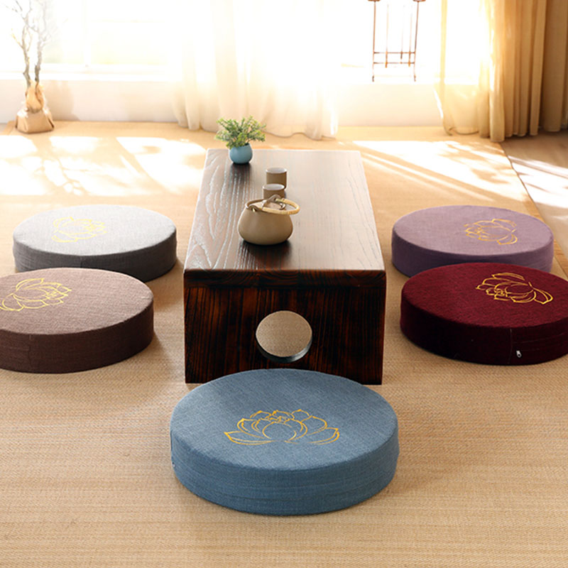 Lotus Meditation Cushion - Five colored cushions around tea table with sunlit window, meditation
