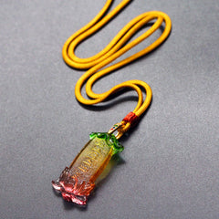 Buddha Liuli Lotus Necklace – close-up of six-character mantra relief on liuli surface, zen accessory