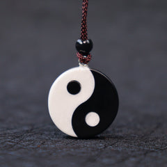 Black Obsidian White Turquoise Yin Yang Strength Fulfilment Necklace Pendant - Front view obsidian turquoise yin-yang amulet