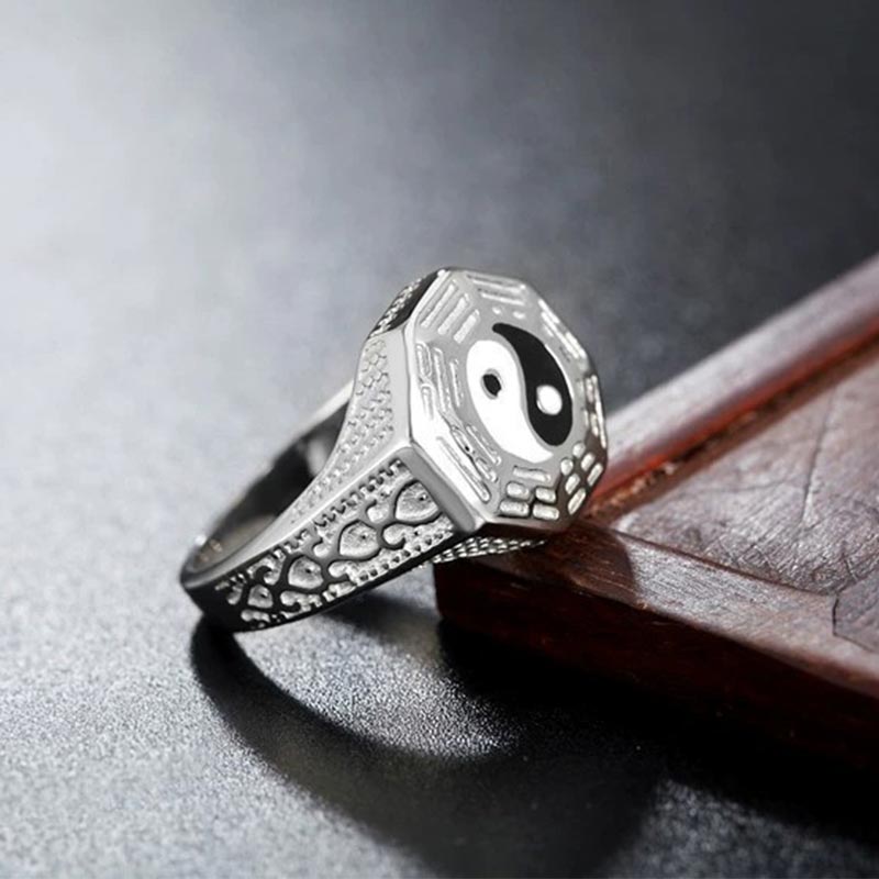 Yin Yang Copper Luck Ring - Silver signet with yin-yang bagua on stone surface, men's balance ring