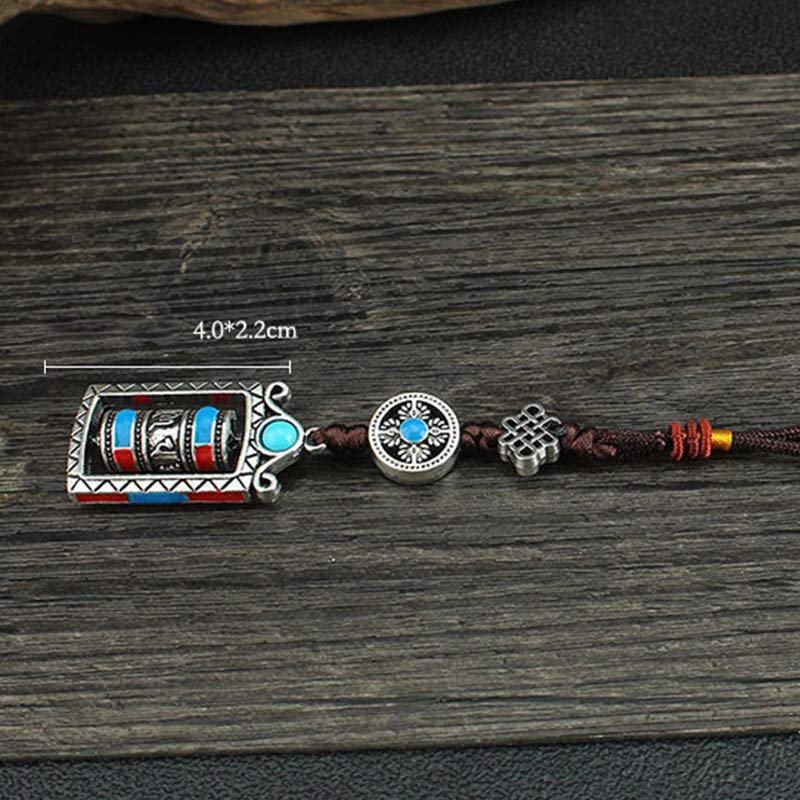 Om Mani Padme Hum Prayer Wheel Keychain – Flat lay with 4.0x2.2cm size annotation, catalog product shot, Buddhist keychain