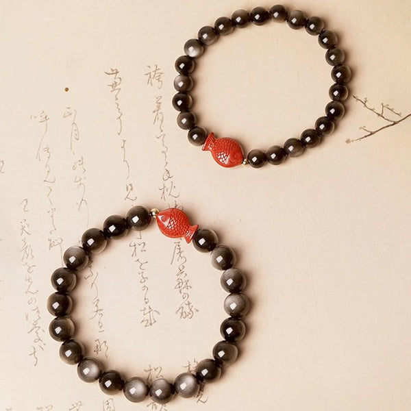 Silver Sheen Obsidian Bracelet – macro of obsidian iridescent flash, cinnabar koi fish detail